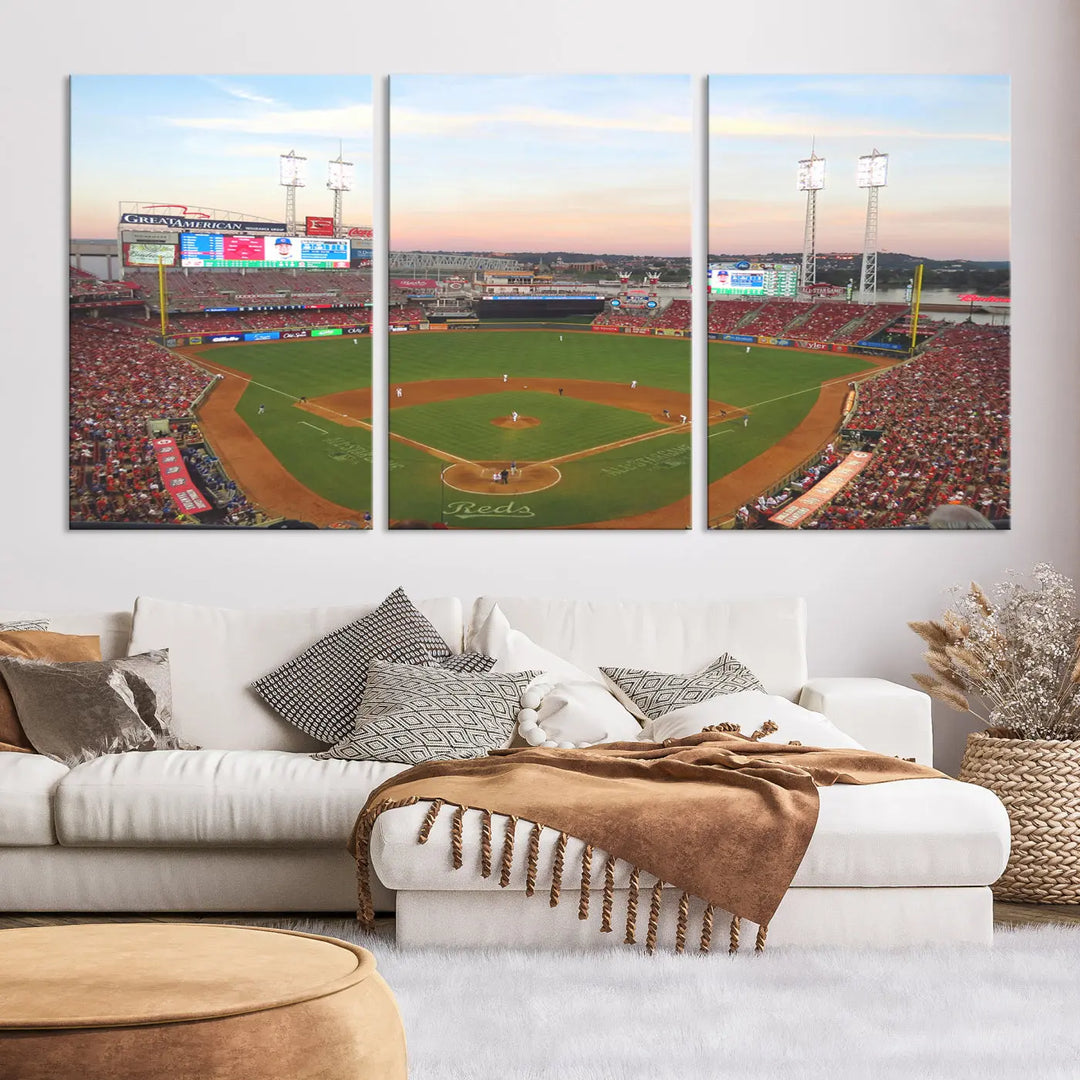 A canvas print of the Cincinnati Reds Baseball Team features a stunning image of the Great American Ball Park at sunset.