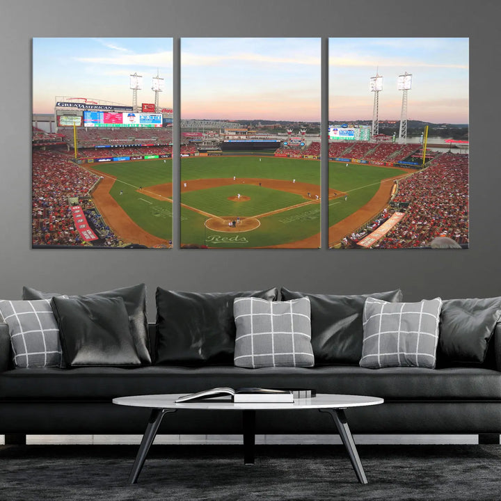 A canvas print of the Cincinnati Reds Baseball Team features a stunning image of the Great American Ball Park at sunset.