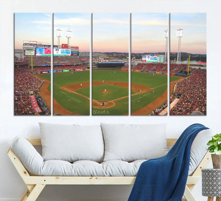 A canvas print of the Cincinnati Reds Baseball Team features a stunning image of the Great American Ball Park at sunset.