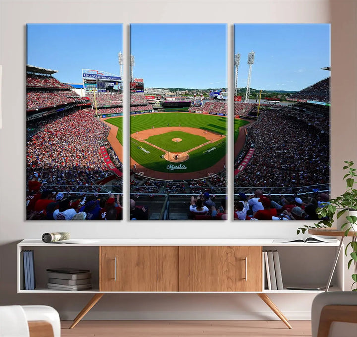 Wall art showcasing the Cincinnati Reds Baseball Team Print features a panoramic view of a bustling Great American Ball Park Stadium on a gallery-quality canvas.