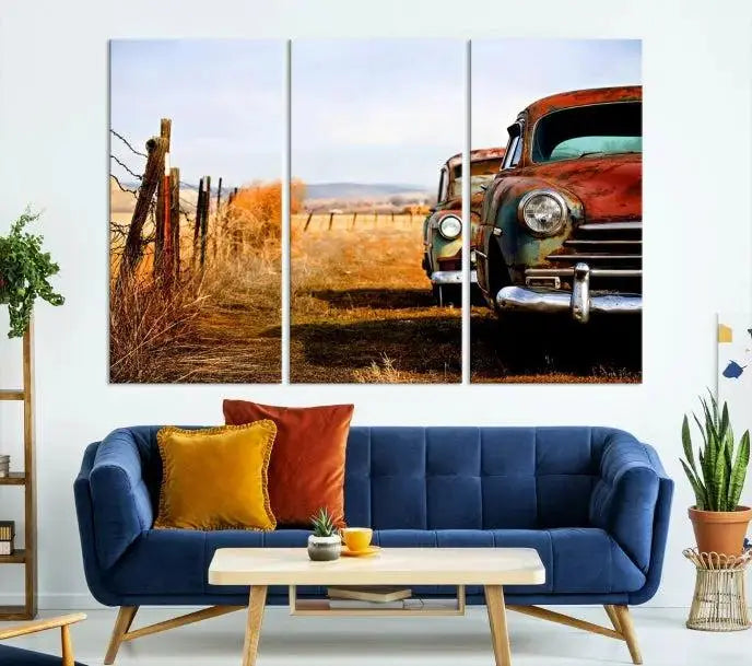 The Classic Cars Vintage Wall Art Canvas Print, featuring a triptych of vintage cars in a rural landscape and gallery wrapped on museum-quality polycotton, elegantly hangs on the wall.