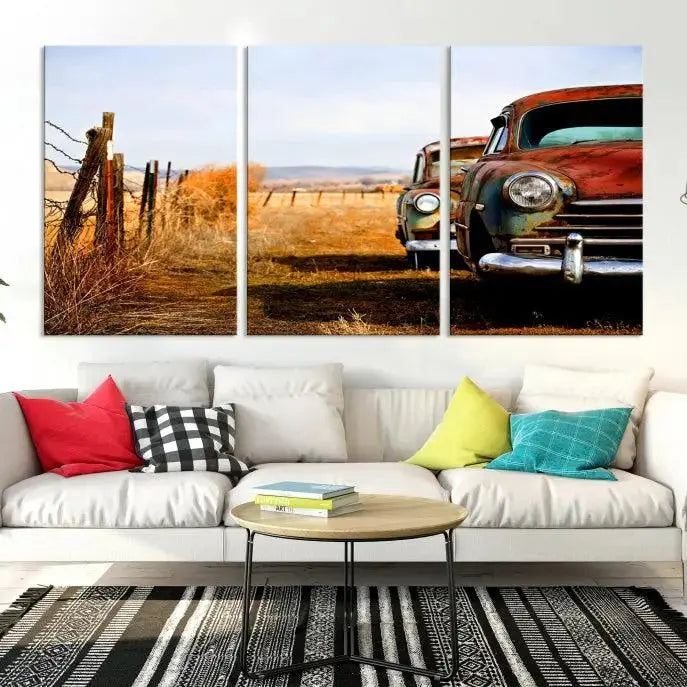 The Classic Cars Vintage Wall Art Canvas Print, featuring a triptych of vintage cars in a rural landscape and gallery wrapped on museum-quality polycotton, elegantly hangs on the wall.