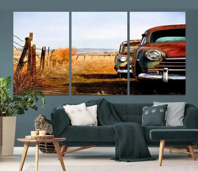 The Classic Cars Vintage Wall Art Canvas Print, featuring a triptych of vintage cars in a rural landscape and gallery wrapped on museum-quality polycotton, elegantly hangs on the wall.