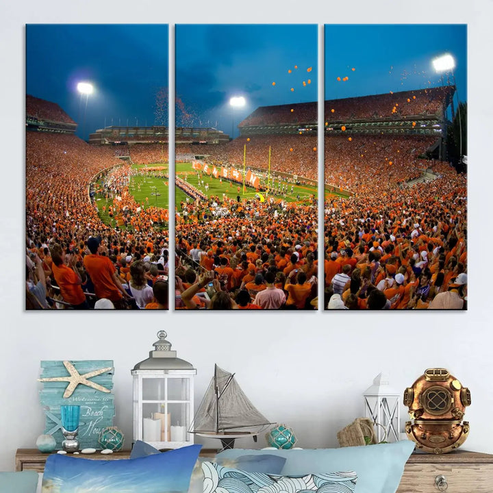 Imagine a stunning wall art canvas that captures the excitement and energy of a large football stadium packed with fans donned in orange. This Clemson University Tigers Football Team Print showcases Clemson Memorial Stadium under vibrant lights, transforming history into an enduring masterpiece.