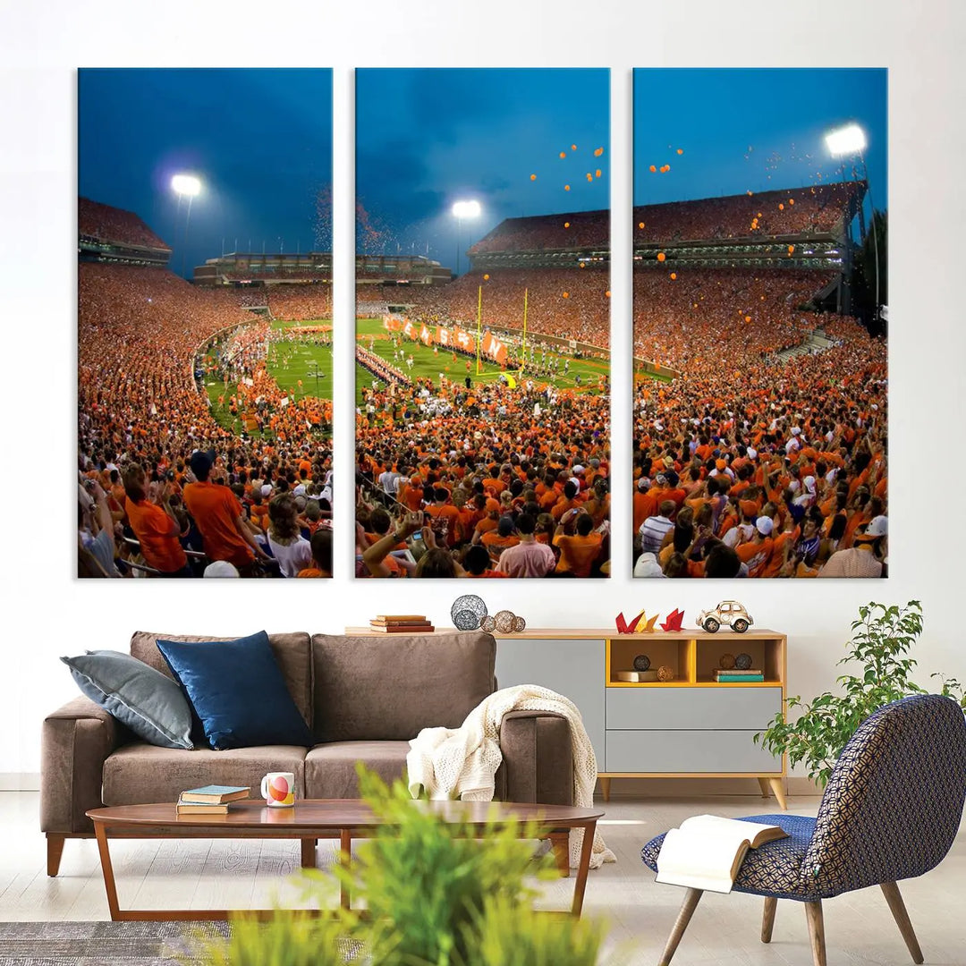 Imagine a stunning wall art canvas that captures the excitement and energy of a large football stadium packed with fans donned in orange. This Clemson University Tigers Football Team Print showcases Clemson Memorial Stadium under vibrant lights, transforming history into an enduring masterpiece.