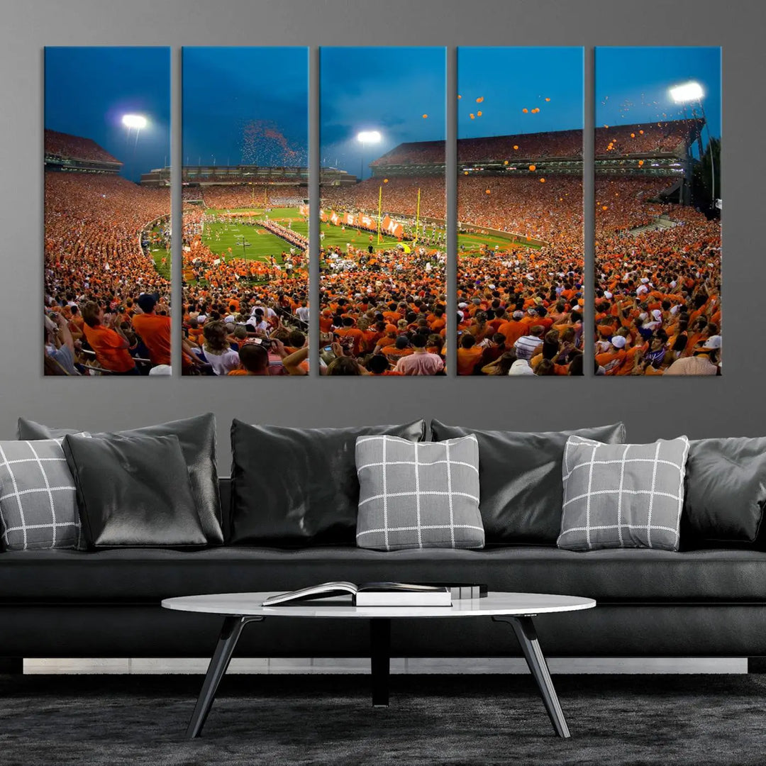 Imagine a stunning wall art canvas that captures the excitement and energy of a large football stadium packed with fans donned in orange. This Clemson University Tigers Football Team Print showcases Clemson Memorial Stadium under vibrant lights, transforming history into an enduring masterpiece.