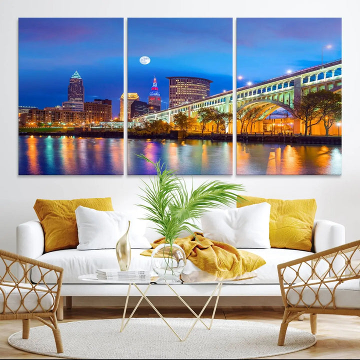 Dining room featuring a Cleveland Night Skyline Wall Art Cityscape Canvas Print with a lit-up bridge reflecting in the water.