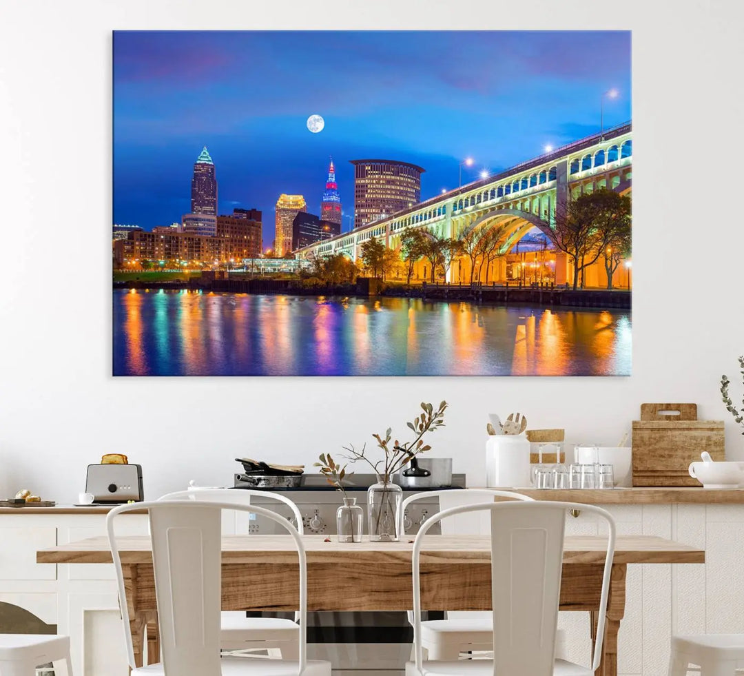 Dining room featuring a Cleveland Night Skyline Wall Art Cityscape Canvas Print with a lit-up bridge reflecting in the water.