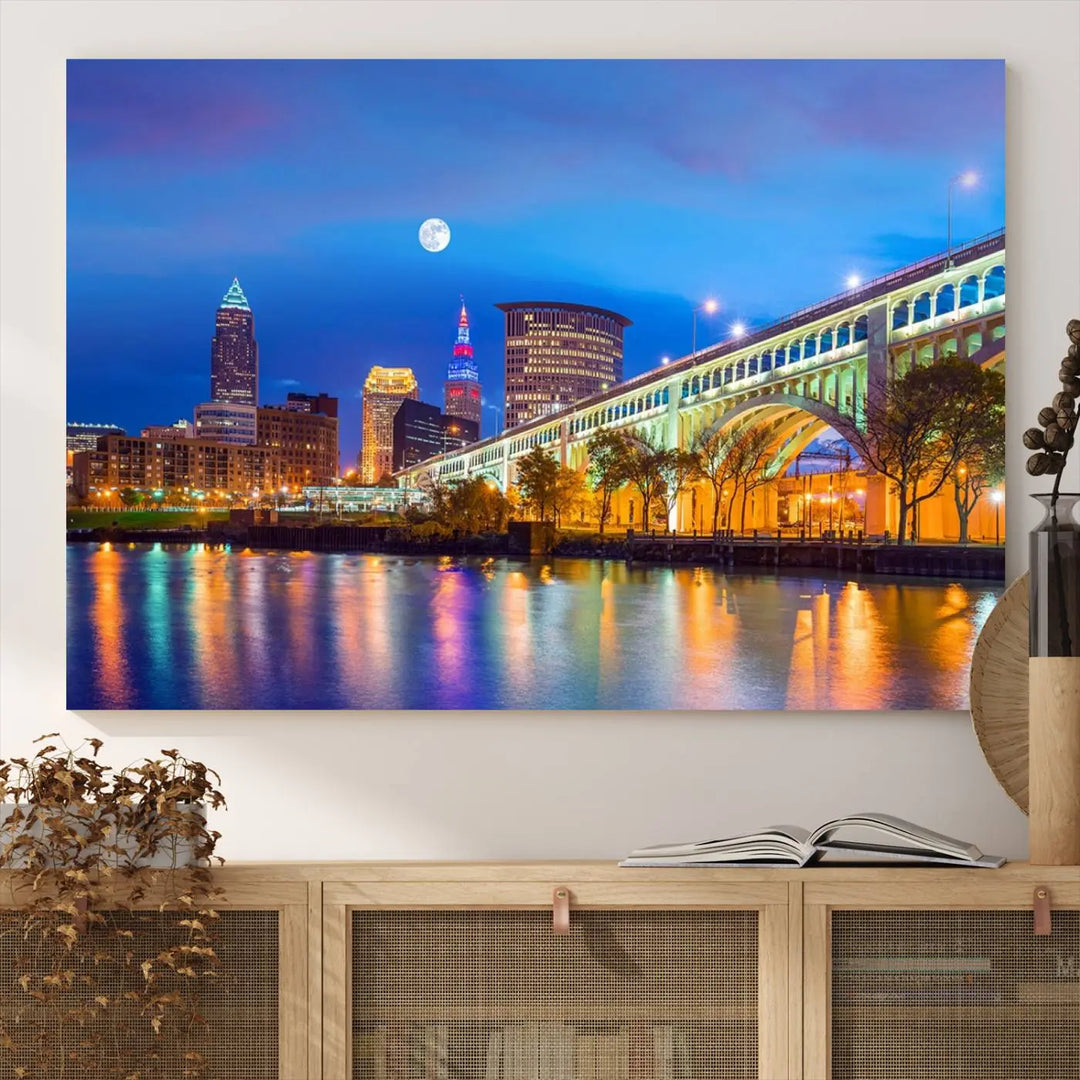 Dining room featuring a Cleveland Night Skyline Wall Art Cityscape Canvas Print with a lit-up bridge reflecting in the water.