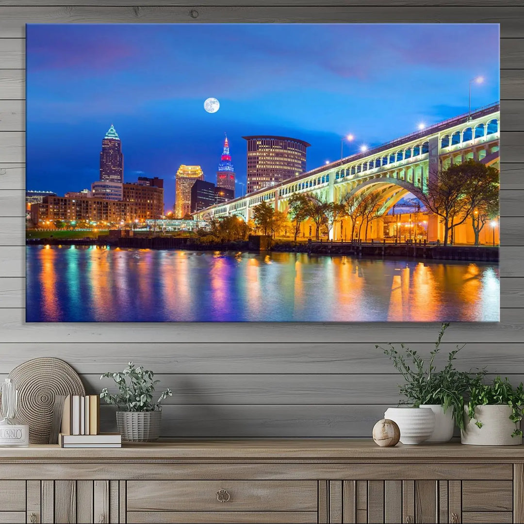 Dining room featuring a Cleveland Night Skyline Wall Art Cityscape Canvas Print with a lit-up bridge reflecting in the water.