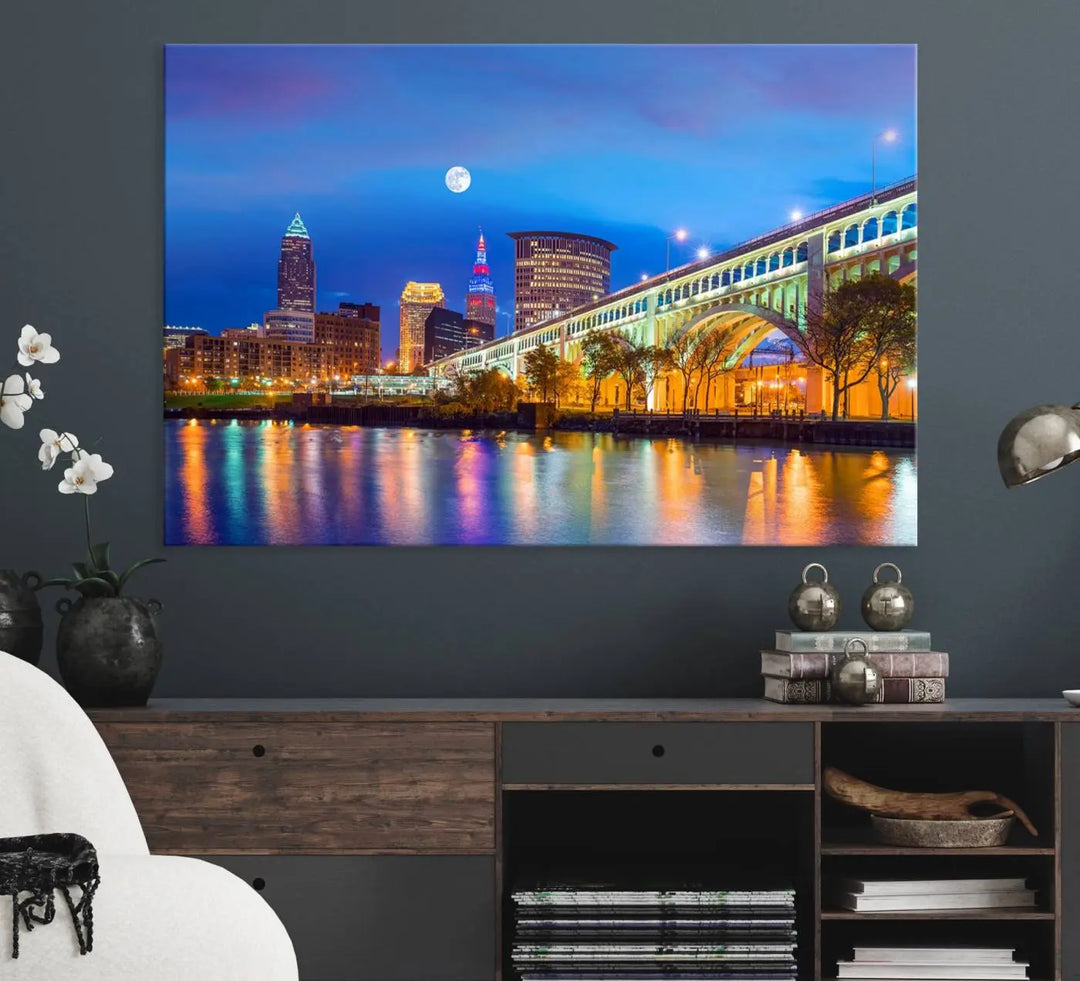 Dining room featuring a Cleveland Night Skyline Wall Art Cityscape Canvas Print with a lit-up bridge reflecting in the water.