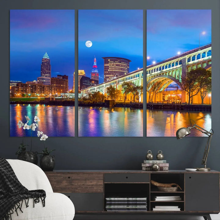 Dining room featuring a Cleveland Night Skyline Wall Art Cityscape Canvas Print with a lit-up bridge reflecting in the water.