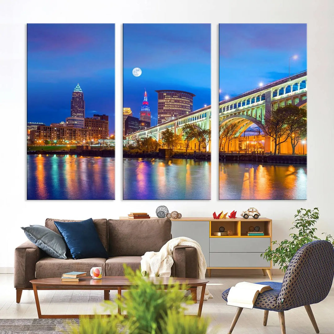 Dining room featuring a Cleveland Night Skyline Wall Art Cityscape Canvas Print with a lit-up bridge reflecting in the water.