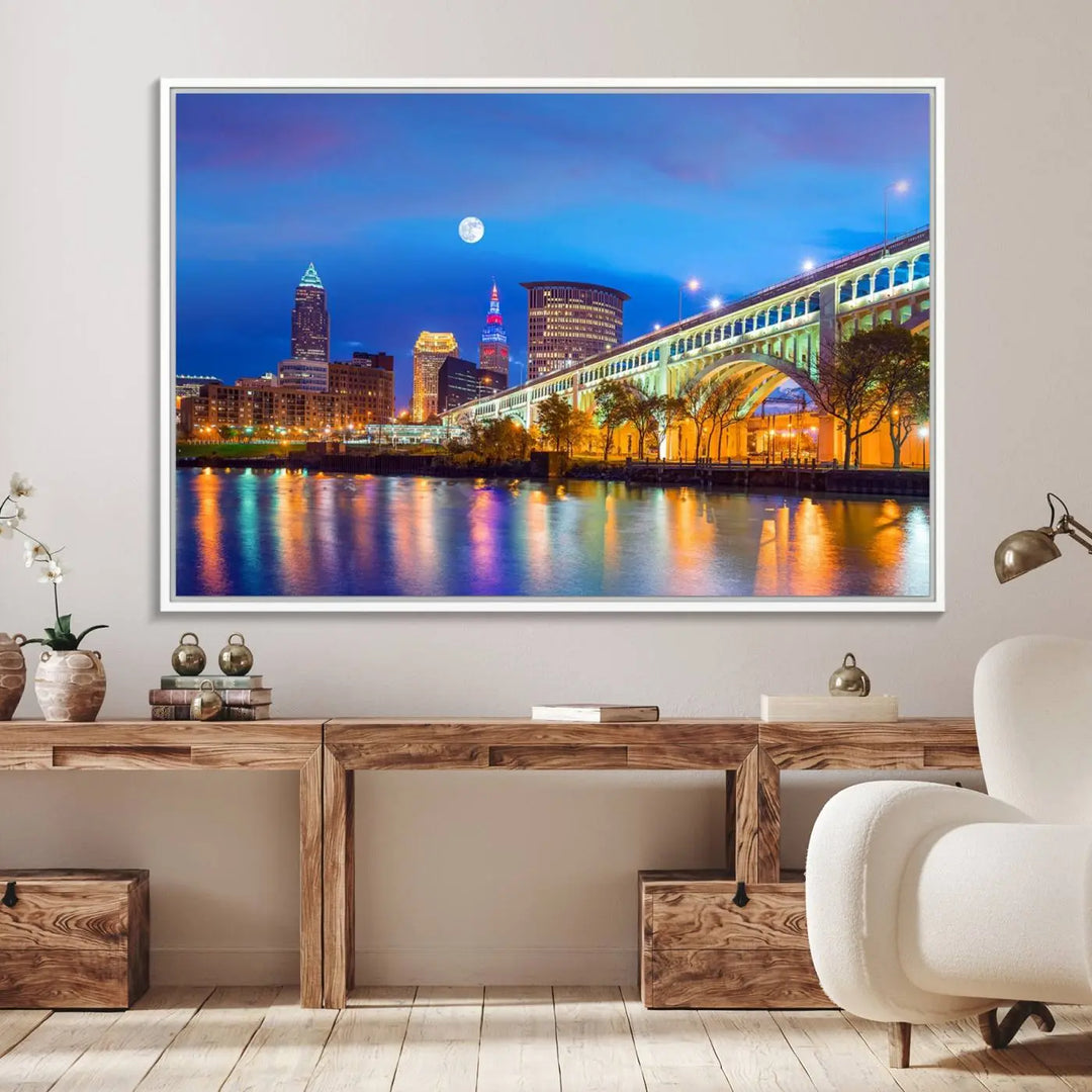 Dining room featuring a Cleveland Night Skyline Wall Art Cityscape Canvas Print with a lit-up bridge reflecting in the water.