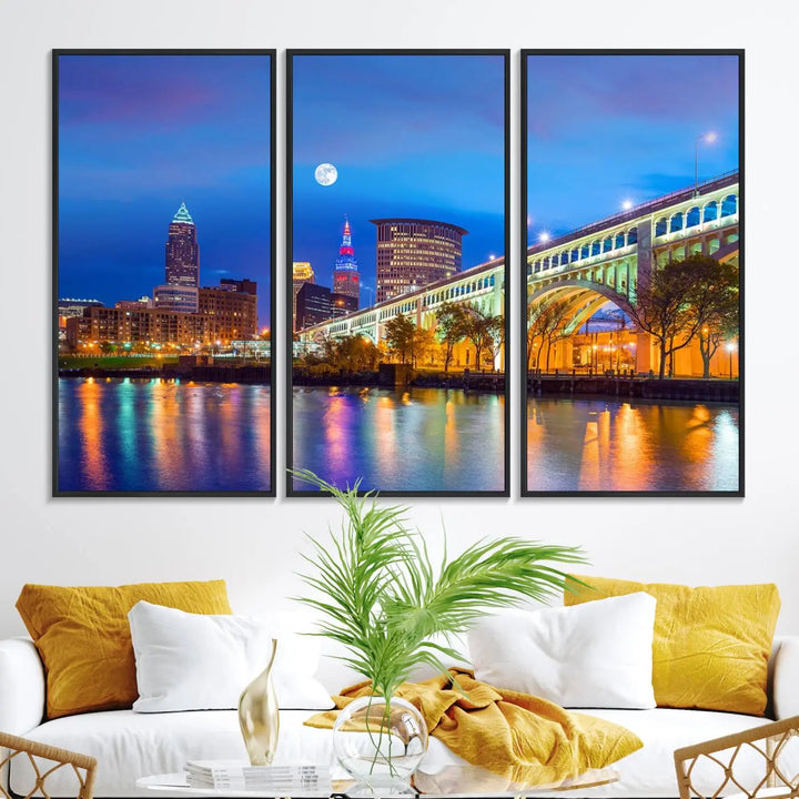 Dining room featuring a Cleveland Night Skyline Wall Art Cityscape Canvas Print with a lit-up bridge reflecting in the water.