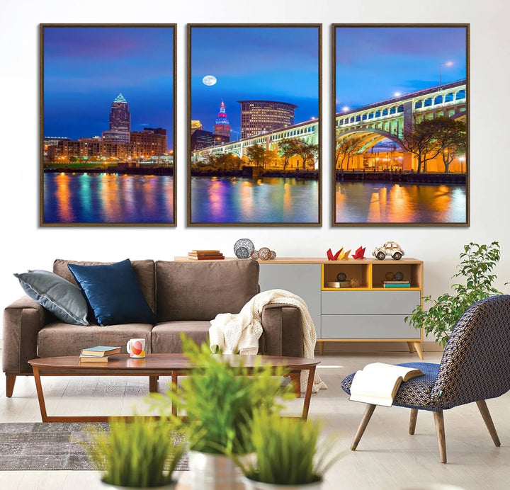 Dining room featuring a Cleveland Night Skyline Wall Art Cityscape Canvas Print with a lit-up bridge reflecting in the water.