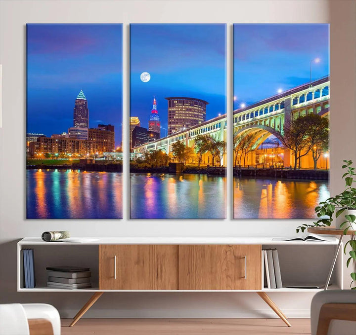 The Cleveland Night Skyline Wall Art City Cityscape Canvas Print portrays a city skyline and bridge lit up against the night sky. This artwork is printed on museum-quality canvas with a gallery-wrapped finish and features a UV-protective coating to ensure lasting vibrancy.