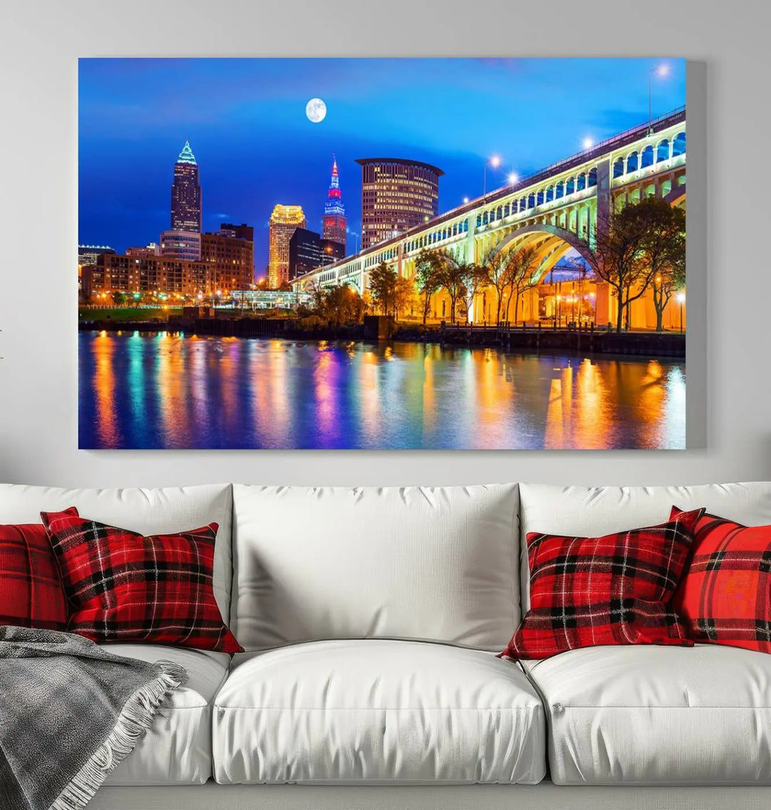 The living room features the "Cleveland Night Skyline Wall Art City Cityscape Canvas Print" prominently displayed, ready to hang.