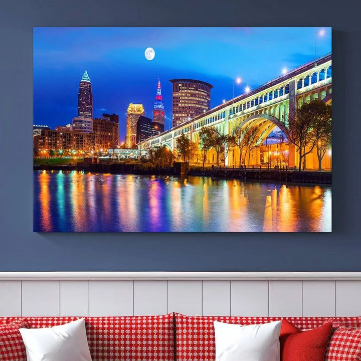 The living room features the "Cleveland Night Skyline Wall Art City Cityscape Canvas Print" prominently displayed, ready to hang.