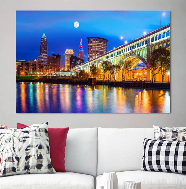 The living room features the "Cleveland Night Skyline Wall Art City Cityscape Canvas Print" prominently displayed, ready to hang.