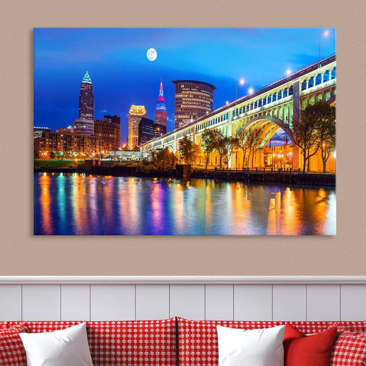 The living room features the "Cleveland Night Skyline Wall Art City Cityscape Canvas Print" prominently displayed, ready to hang.