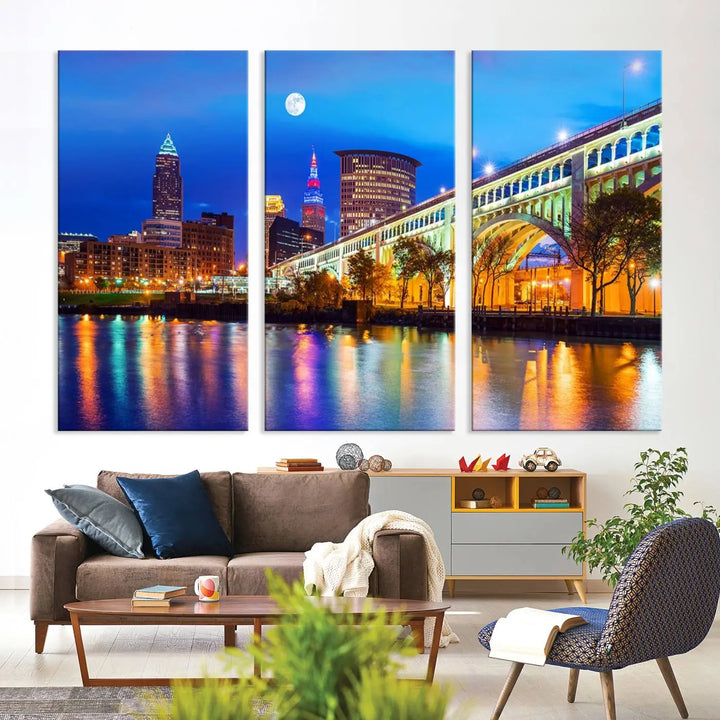 The living room features the "Cleveland Night Skyline Wall Art City Cityscape Canvas Print" prominently displayed, ready to hang.