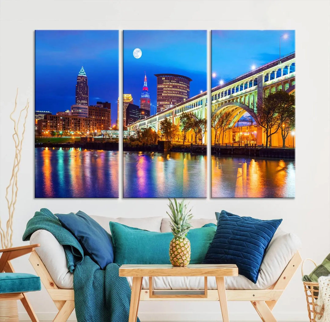 The living room features the "Cleveland Night Skyline Wall Art City Cityscape Canvas Print" prominently displayed, ready to hang.