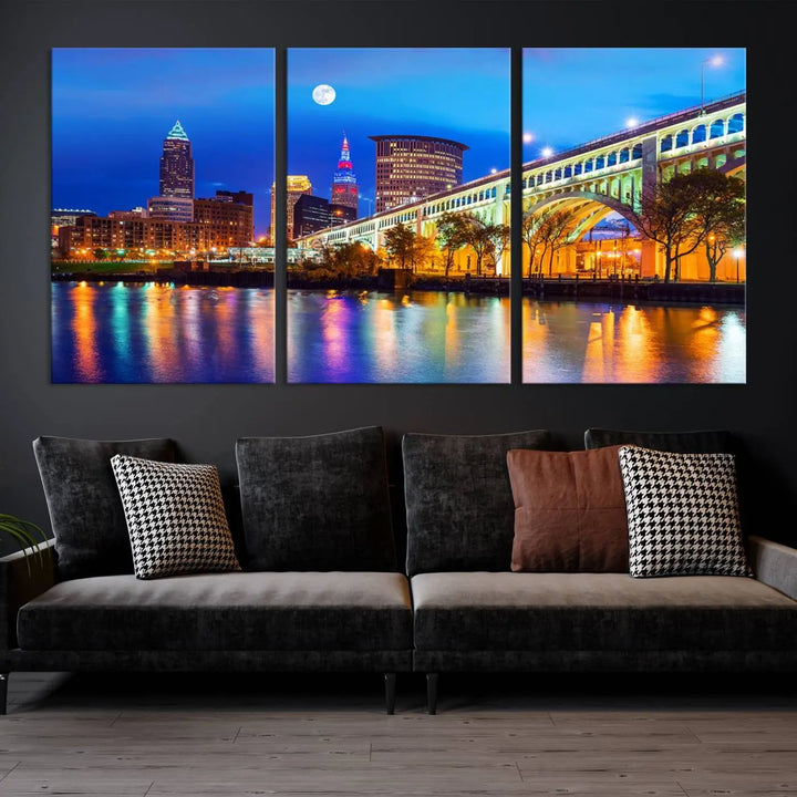 The living room features the "Cleveland Night Skyline Wall Art City Cityscape Canvas Print" prominently displayed, ready to hang.