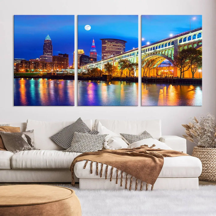 The living room features the "Cleveland Night Skyline Wall Art City Cityscape Canvas Print" prominently displayed, ready to hang.