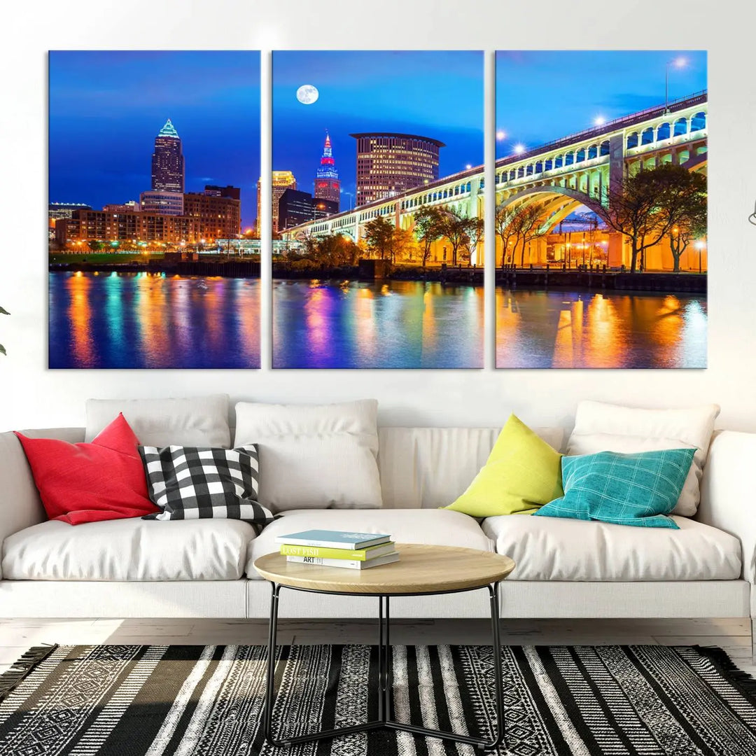 The living room features the "Cleveland Night Skyline Wall Art City Cityscape Canvas Print" prominently displayed, ready to hang.