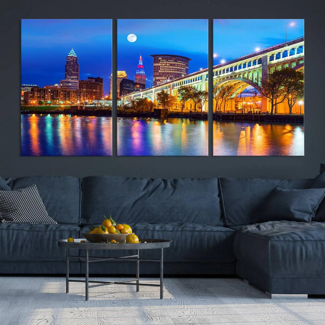 The living room features the "Cleveland Night Skyline Wall Art City Cityscape Canvas Print" prominently displayed, ready to hang.