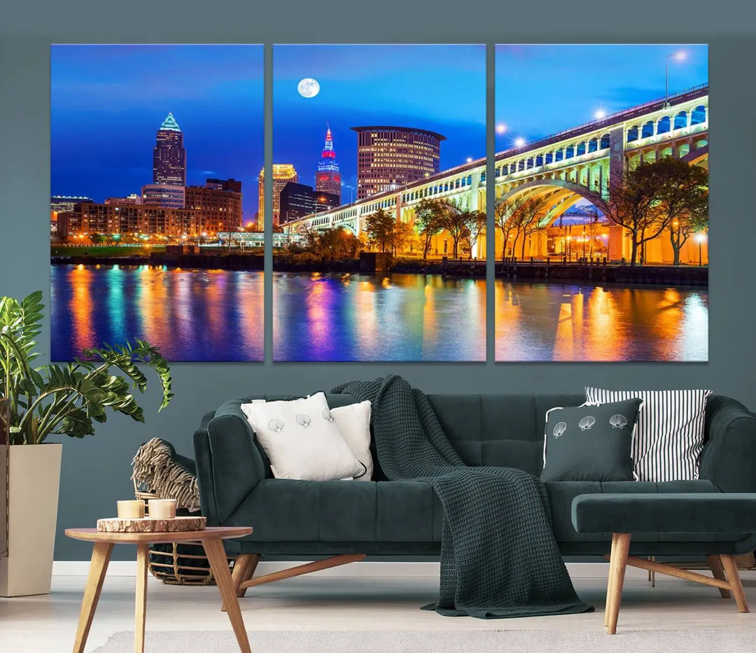 The living room features the "Cleveland Night Skyline Wall Art City Cityscape Canvas Print" prominently displayed, ready to hang.