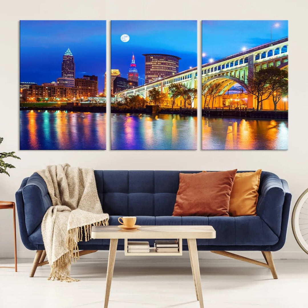 The living room features the "Cleveland Night Skyline Wall Art City Cityscape Canvas Print" prominently displayed, ready to hang.