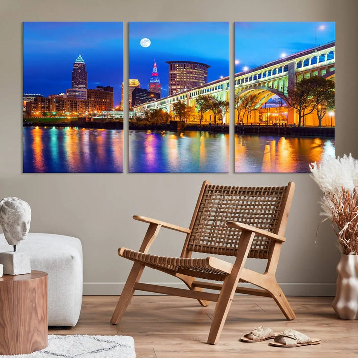 The living room features the "Cleveland Night Skyline Wall Art City Cityscape Canvas Print" prominently displayed, ready to hang.