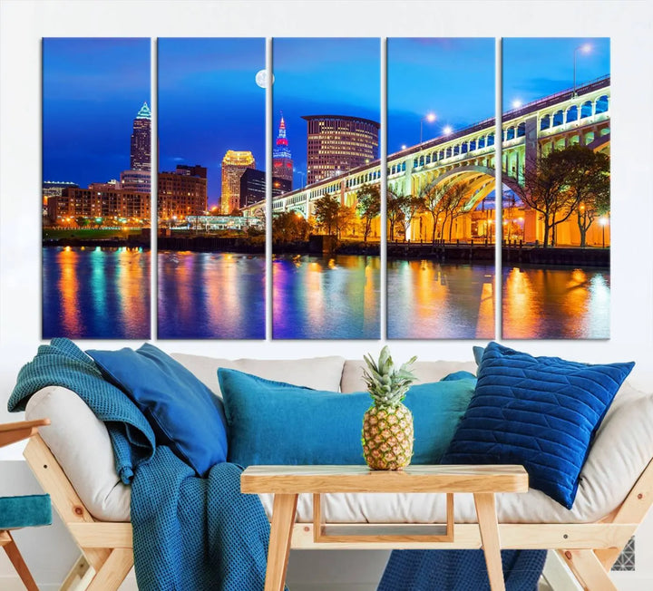 The living room features the "Cleveland Night Skyline Wall Art City Cityscape Canvas Print" prominently displayed, ready to hang.