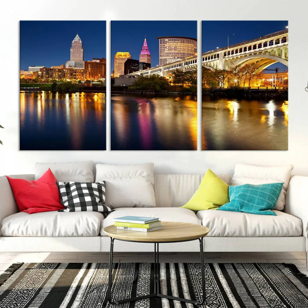 The "Cleveland Night Skyline Wall Art City Cityscape Canvas Print" is a striking feature in the room, showcasing a city skyline with a bridge reflecting in a river. Displayed on museum-quality canvas, it offers enduring beauty.