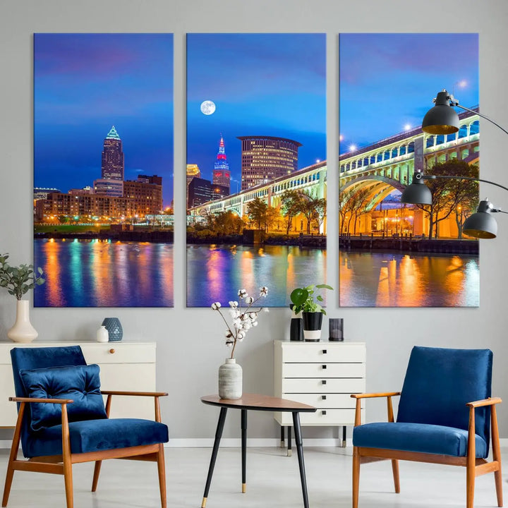 A modern living room features the Cleveland Night Skyline Wall Art City Cityscape Canvas Print, meticulously gallery wrapped on museum-quality canvas.