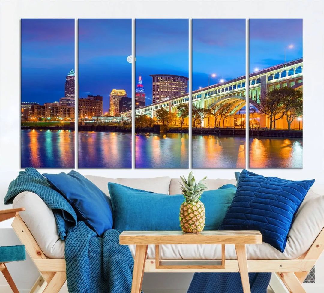 A modern living room features the Cleveland Night Skyline Wall Art City Cityscape Canvas Print, meticulously gallery wrapped on museum-quality canvas.