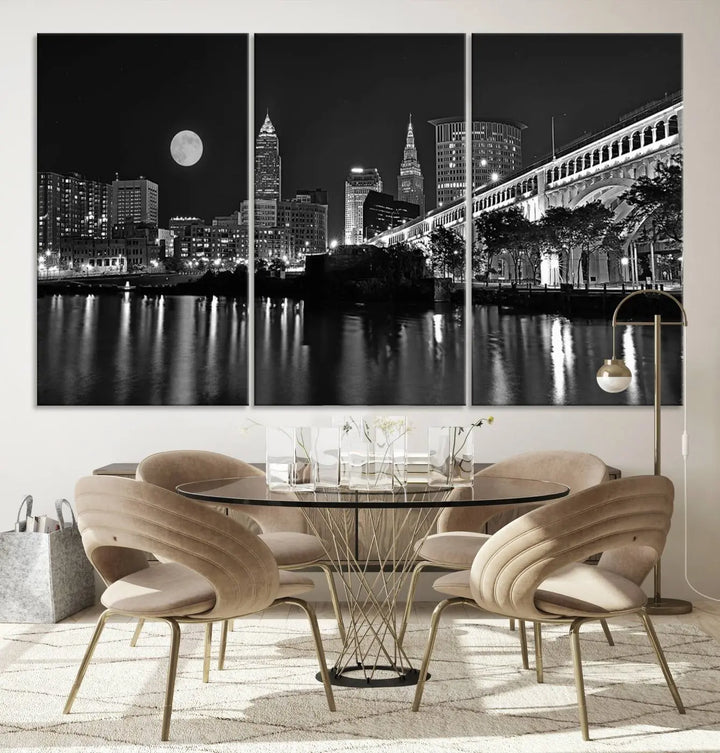 A modern living room features the "Cleveland Night Skyline Wall Art City Cityscape Canvas Print" on the wall, showcasing a moonlit skyline and river. It is professionally gallery wrapped on museum-quality canvas for enduring elegance.