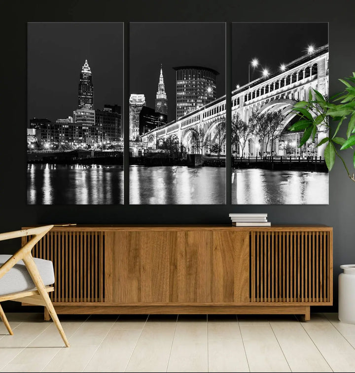 Enhance your space with the Cleveland Night Skyline Wall Art City Cityscape Canvas Print, a museum-quality black and white triptych. This ready-to-hang masterpiece is designed to elevate any room's aesthetic.