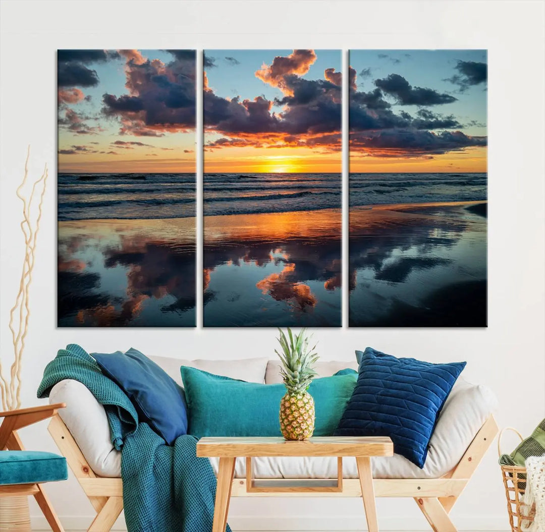 In the living room, the dramatic "Cloudy Weather At The Beach Wall Art Canvas Print" captures an ocean sunset with clouds and reflections on museum-quality canvases crafted in the USA. It features a UV-protective coating to ensure lasting vibrancy.