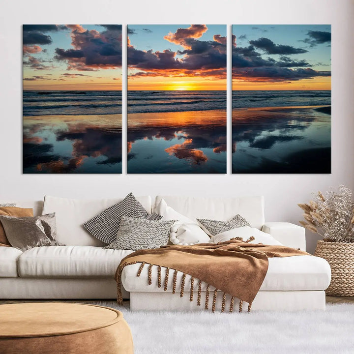 In the living room, the dramatic "Cloudy Weather At The Beach Wall Art Canvas Print" captures an ocean sunset with clouds and reflections on museum-quality canvases crafted in the USA. It features a UV-protective coating to ensure lasting vibrancy.