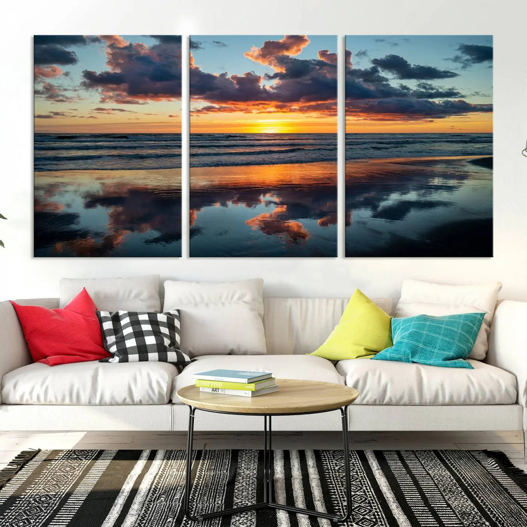 In the living room, the dramatic "Cloudy Weather At The Beach Wall Art Canvas Print" captures an ocean sunset with clouds and reflections on museum-quality canvases crafted in the USA. It features a UV-protective coating to ensure lasting vibrancy.