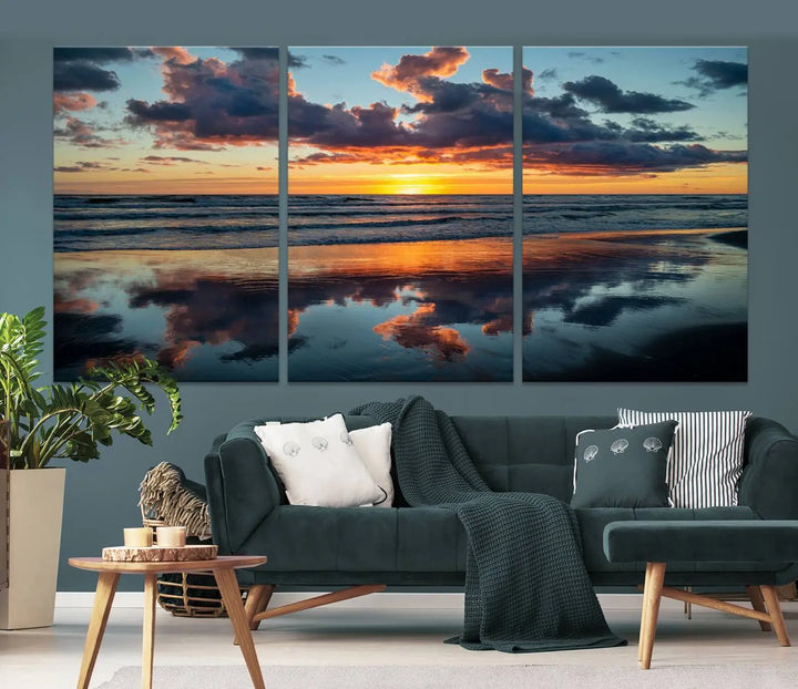 In the living room, the dramatic "Cloudy Weather At The Beach Wall Art Canvas Print" captures an ocean sunset with clouds and reflections on museum-quality canvases crafted in the USA. It features a UV-protective coating to ensure lasting vibrancy.