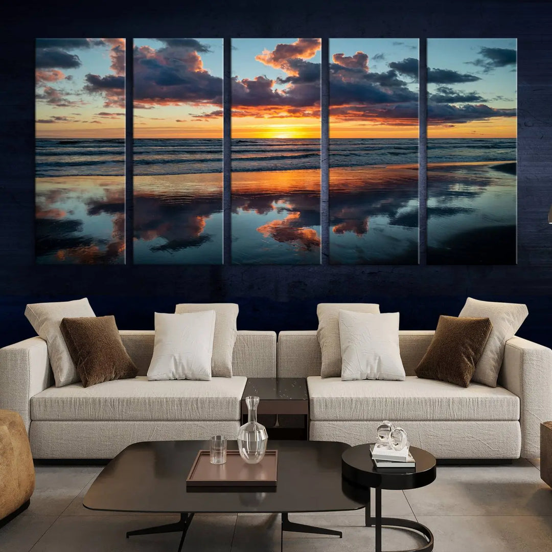 In the living room, the dramatic "Cloudy Weather At The Beach Wall Art Canvas Print" captures an ocean sunset with clouds and reflections on museum-quality canvases crafted in the USA. It features a UV-protective coating to ensure lasting vibrancy.