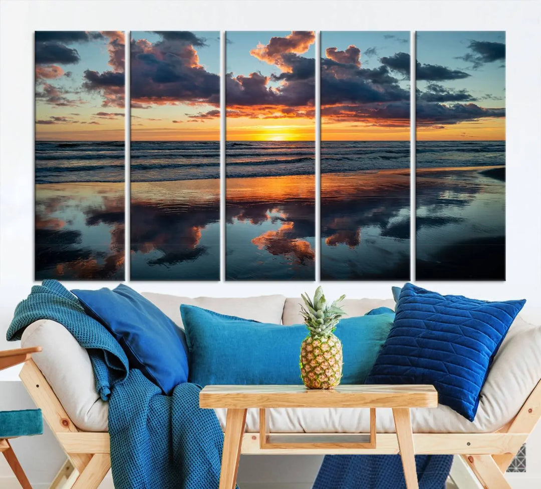 In the living room, the dramatic "Cloudy Weather At The Beach Wall Art Canvas Print" captures an ocean sunset with clouds and reflections on museum-quality canvases crafted in the USA. It features a UV-protective coating to ensure lasting vibrancy.