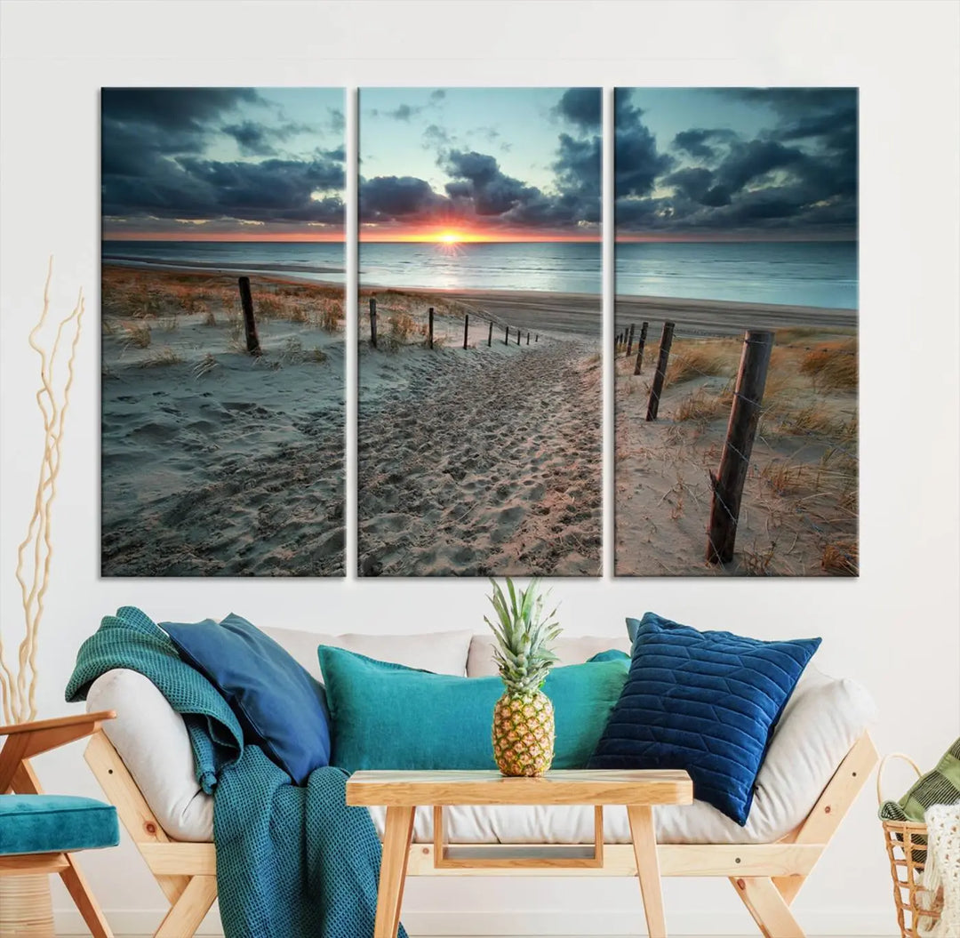 The modern living room features the Cloudy Weather Sunset Beach Wall Art Canvas Print. This museum-quality canvas adds a touch of sophistication with its hand-assembled framed art, ensuring lasting elegance. Enjoy free shipping on this exquisite piece.