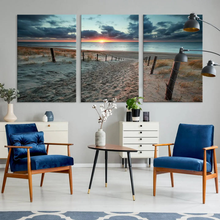 The modern living room features the Cloudy Weather Sunset Beach Wall Art Canvas Print. This museum-quality canvas adds a touch of sophistication with its hand-assembled framed art, ensuring lasting elegance. Enjoy free shipping on this exquisite piece.