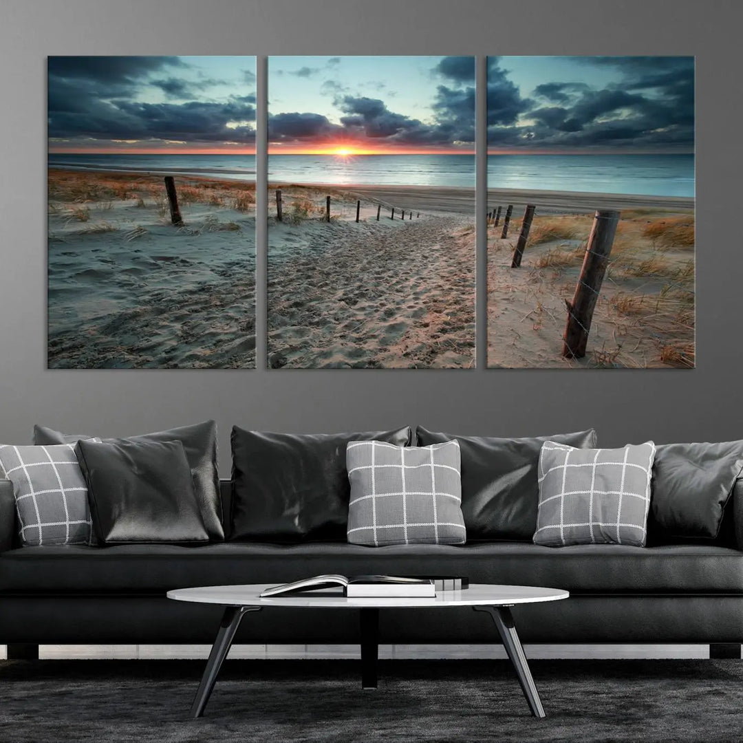 The modern living room features the Cloudy Weather Sunset Beach Wall Art Canvas Print. This museum-quality canvas adds a touch of sophistication with its hand-assembled framed art, ensuring lasting elegance. Enjoy free shipping on this exquisite piece.