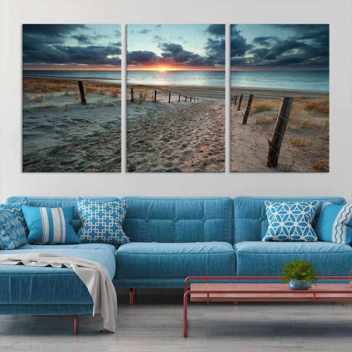 The modern living room features the Cloudy Weather Sunset Beach Wall Art Canvas Print. This museum-quality canvas adds a touch of sophistication with its hand-assembled framed art, ensuring lasting elegance. Enjoy free shipping on this exquisite piece.